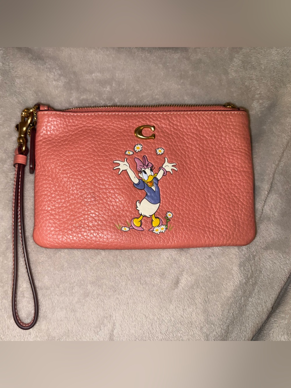 Coach x Disney Coral Leather Daisy Graphic Wristlet with Gold Hardware